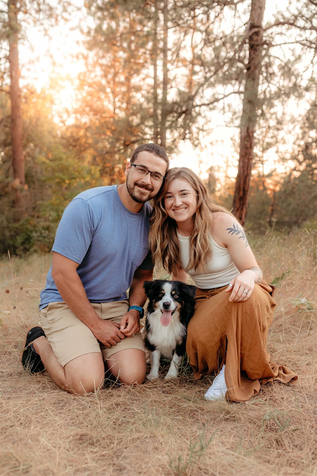 Mike and Madison DeHaan with their dog in the pines outside Spokane